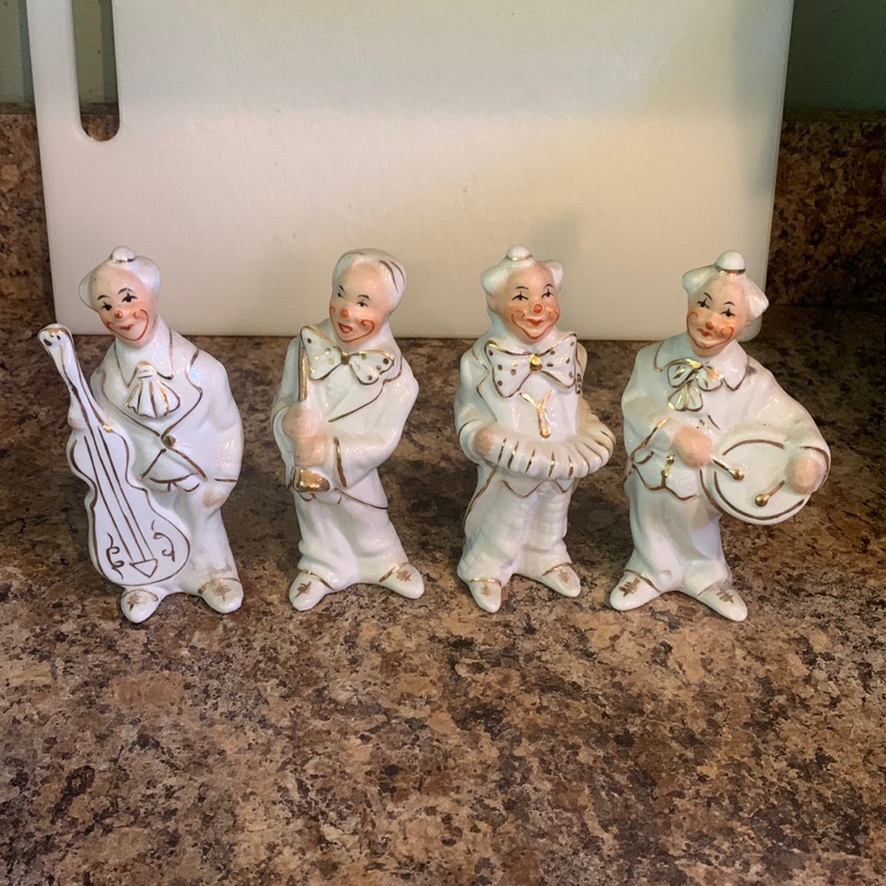 Clown figurines playing instruments